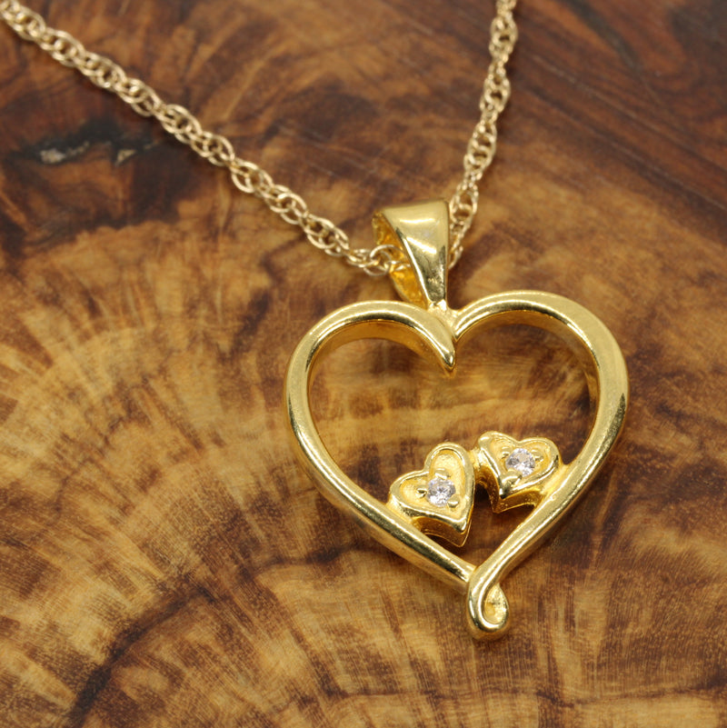 Gold Open Heart with two tiny hearts with a CZ stone in them Necklace