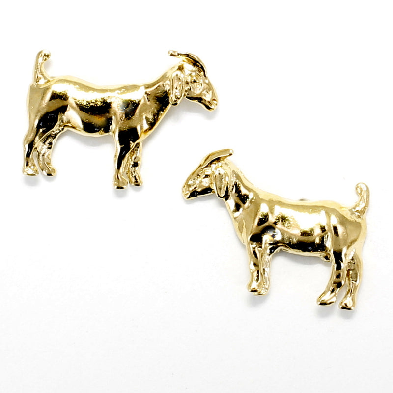 A pair of gold goat earrings.