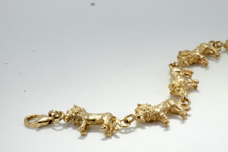 A gold lion bracelet.