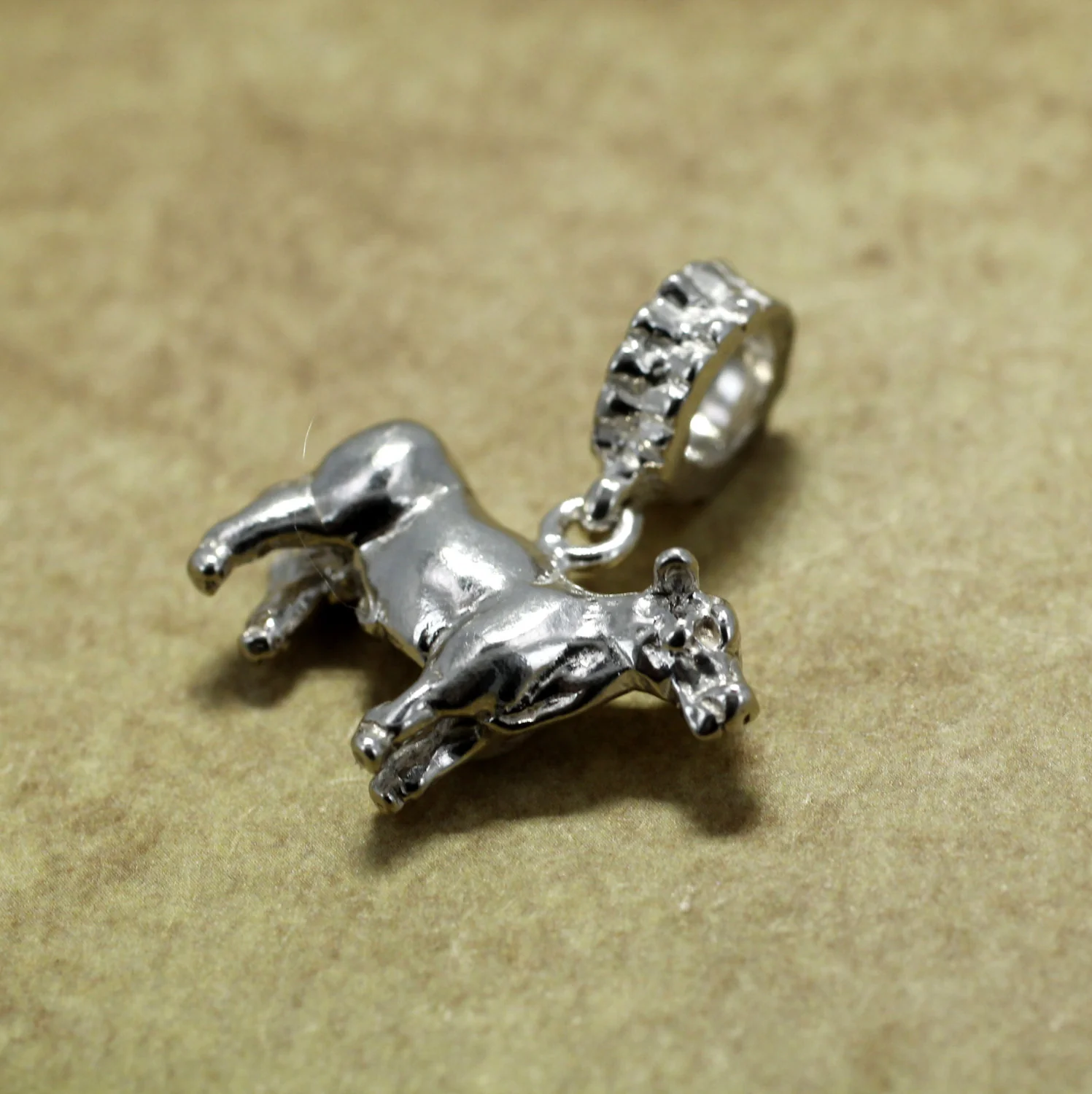 What is the material of the charm?