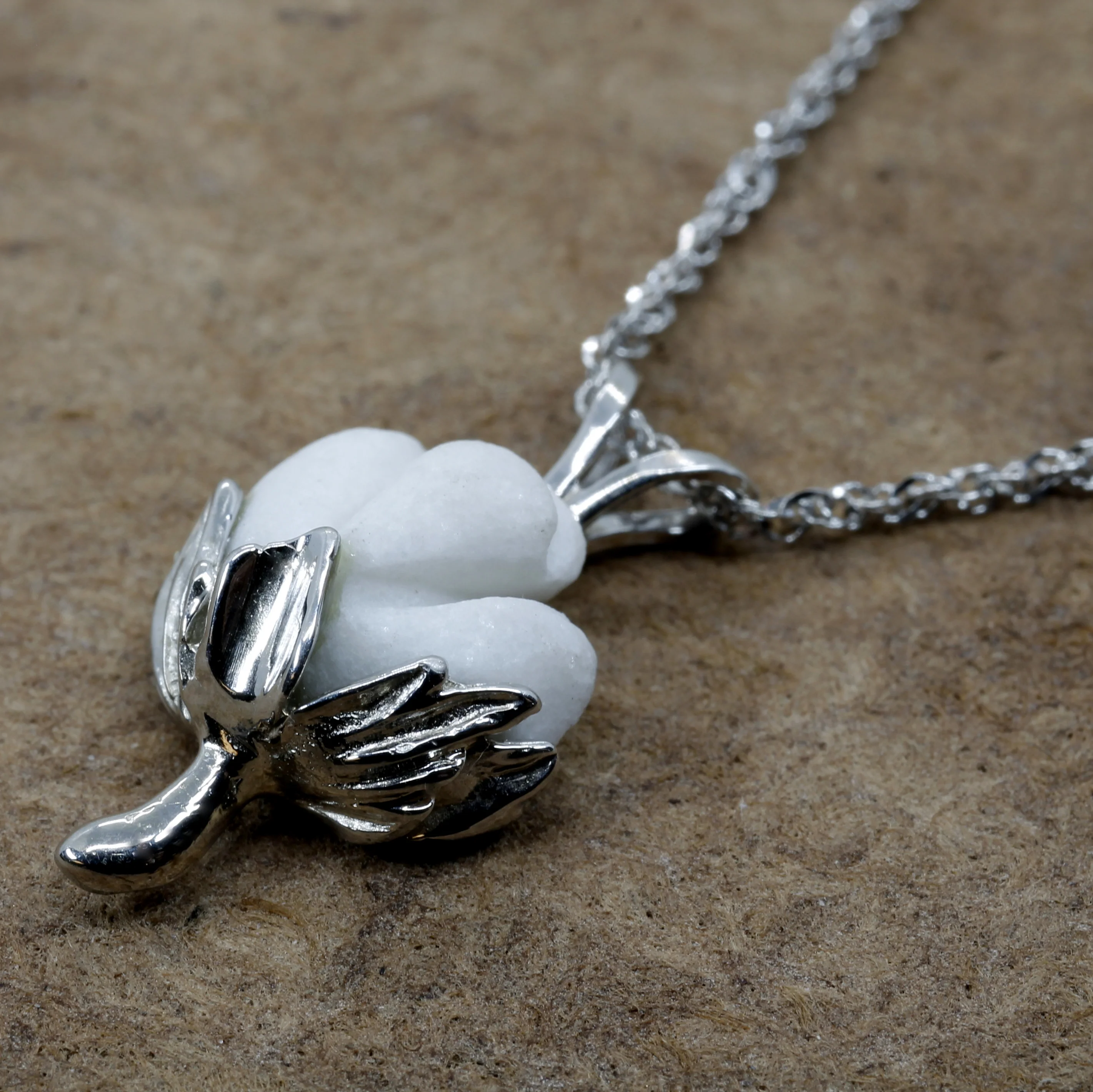 Cotton Boll Necklace in 14kt White Gold with white stone for Cotton Anniversary Questions & Answers