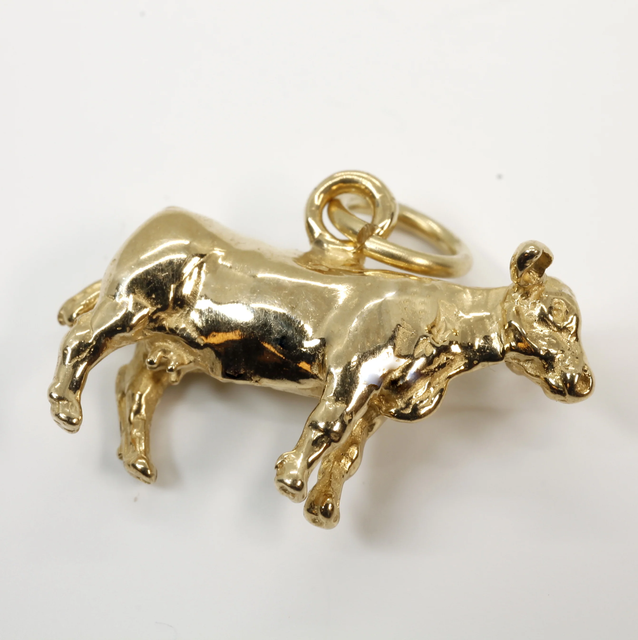 Gold Cow Charm with a 14kt Solid Gold 3-D Cow Questions & Answers
