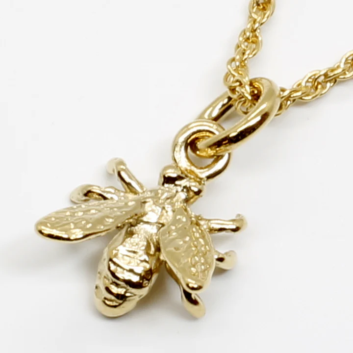 What does the bee jewelry symbolize?