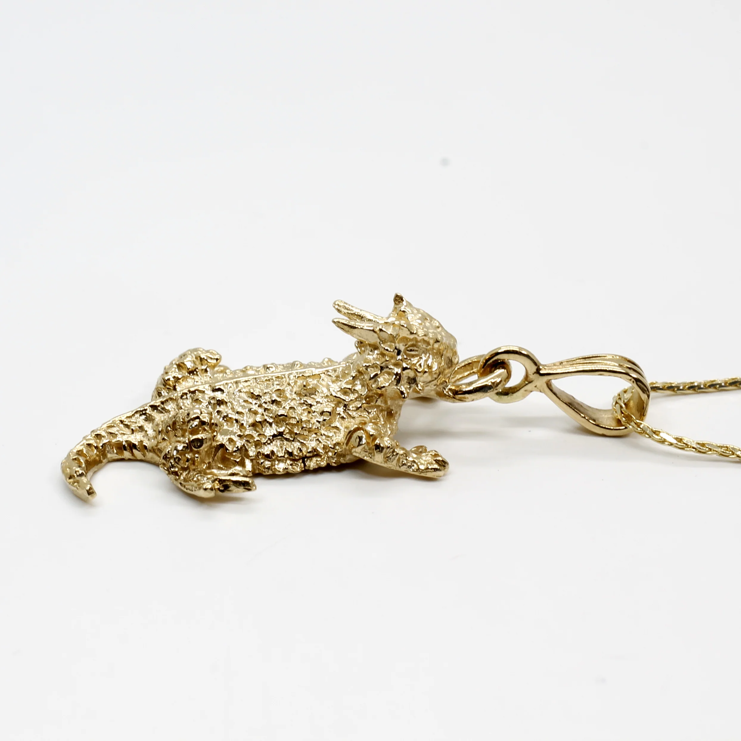 Is there a custom design service available for the horned toad necklace?