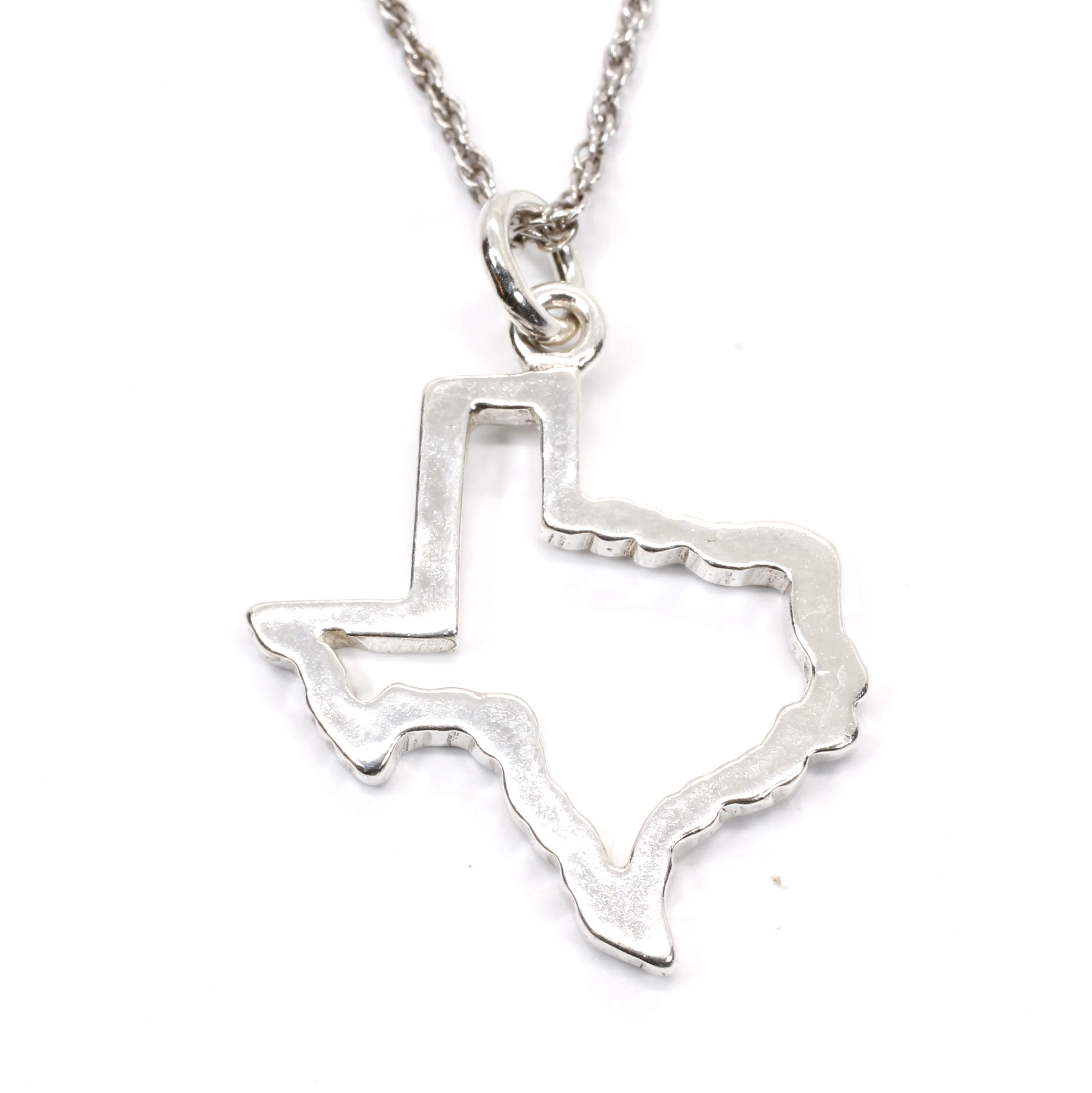 What does the T bar necklace represent?