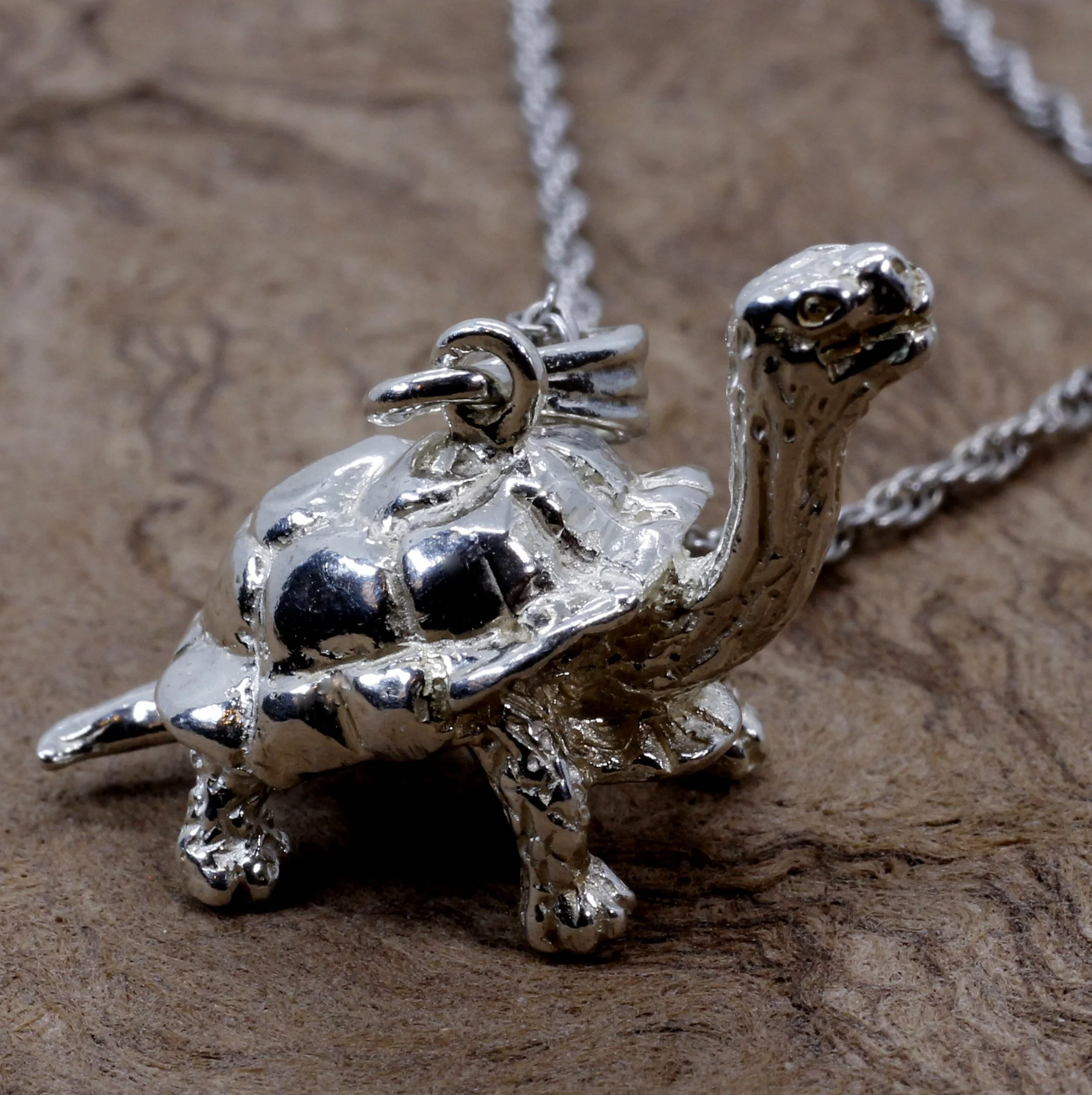 What does a turtle pendant symbolize?