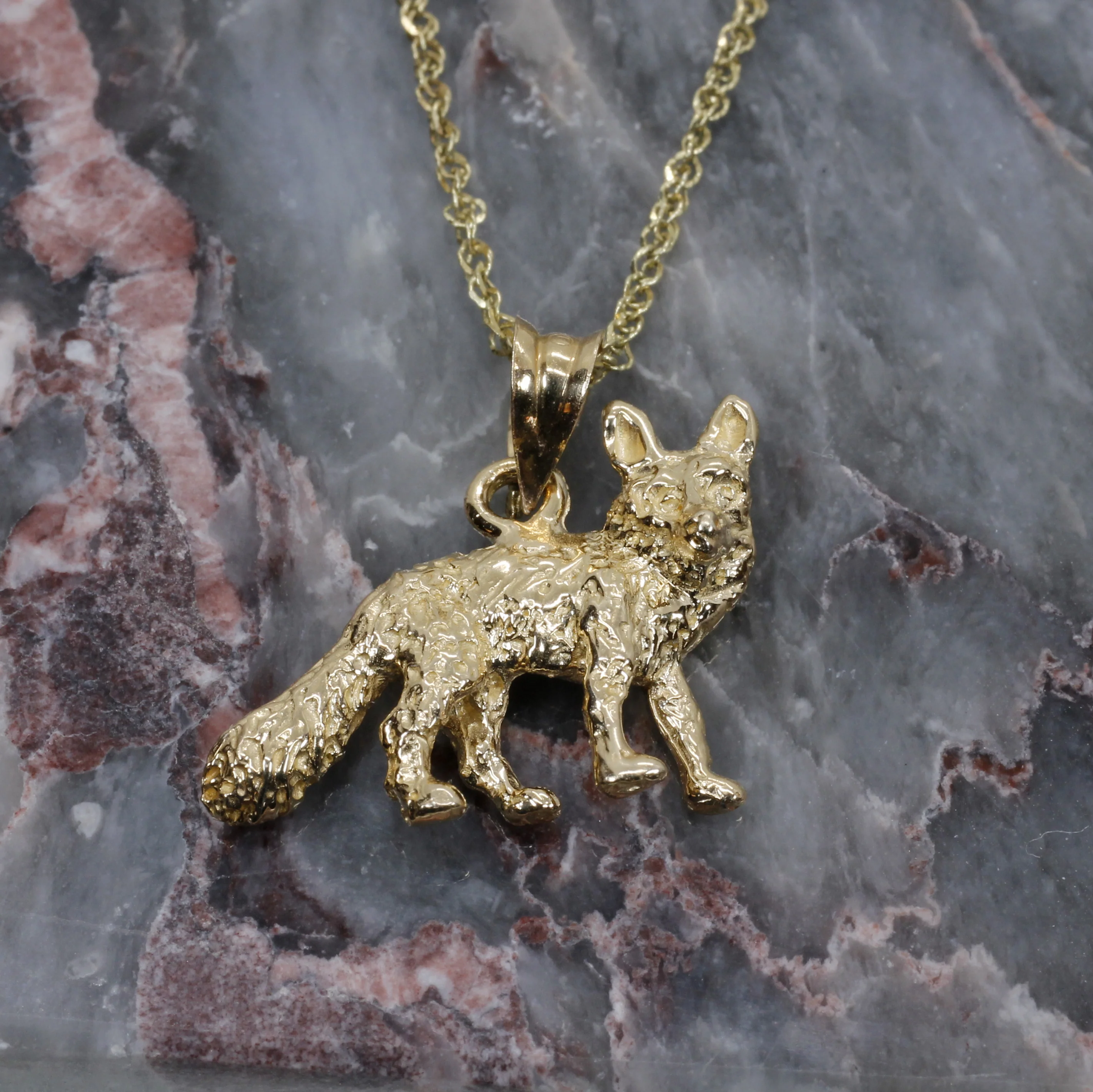 What does a gold pendant symbolize?