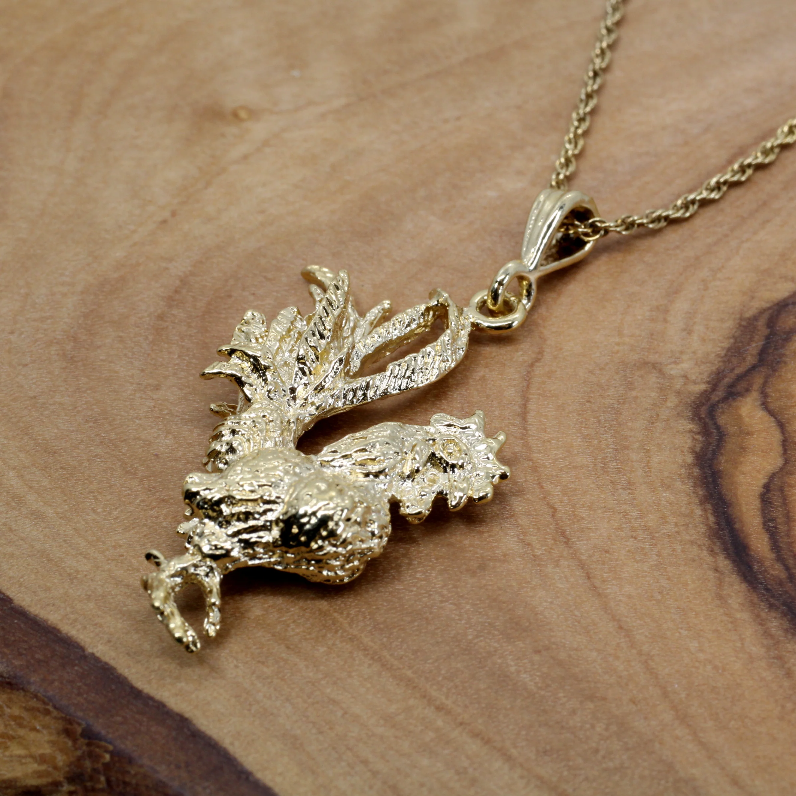 What is the width of the rooster pendant?