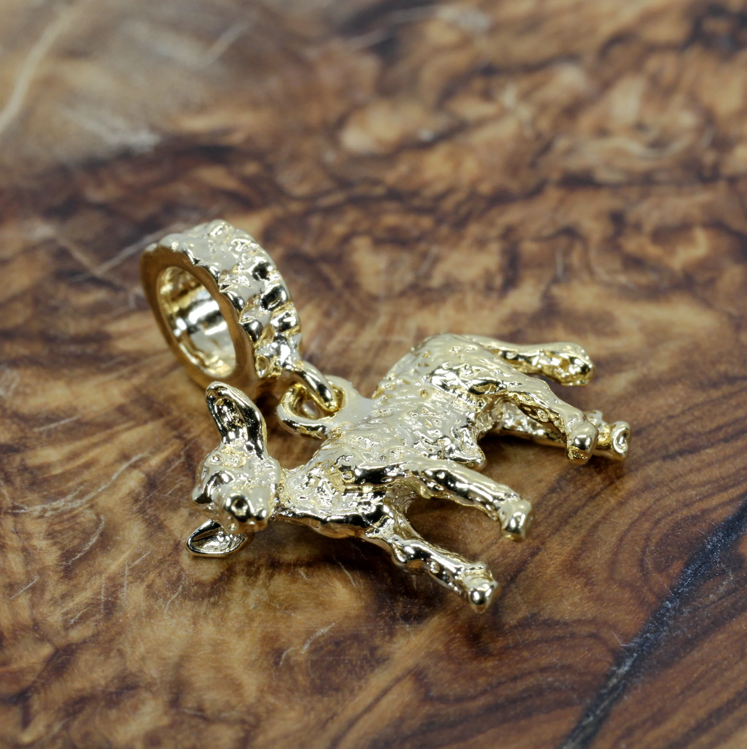 How do charms attach to bracelets?