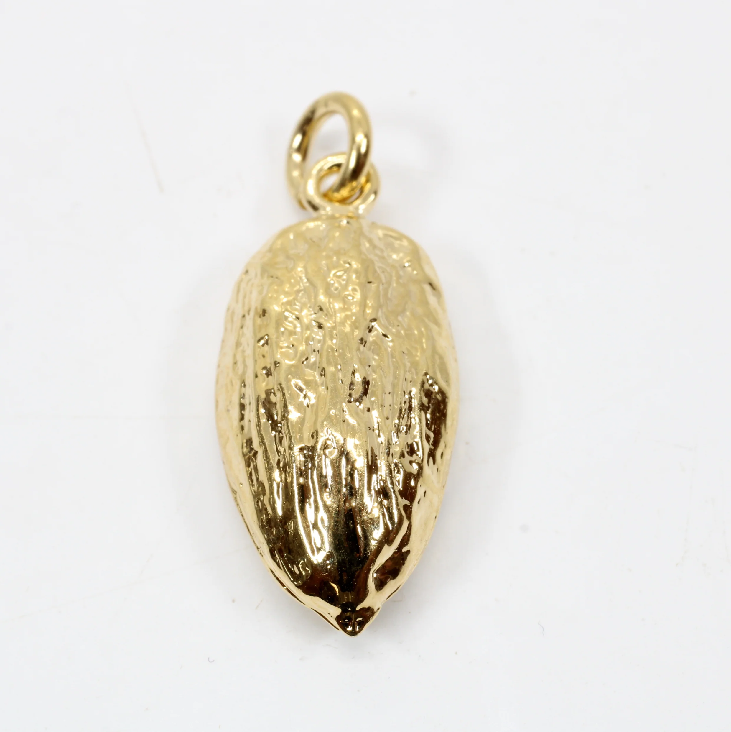 What material is the almond charm made from?