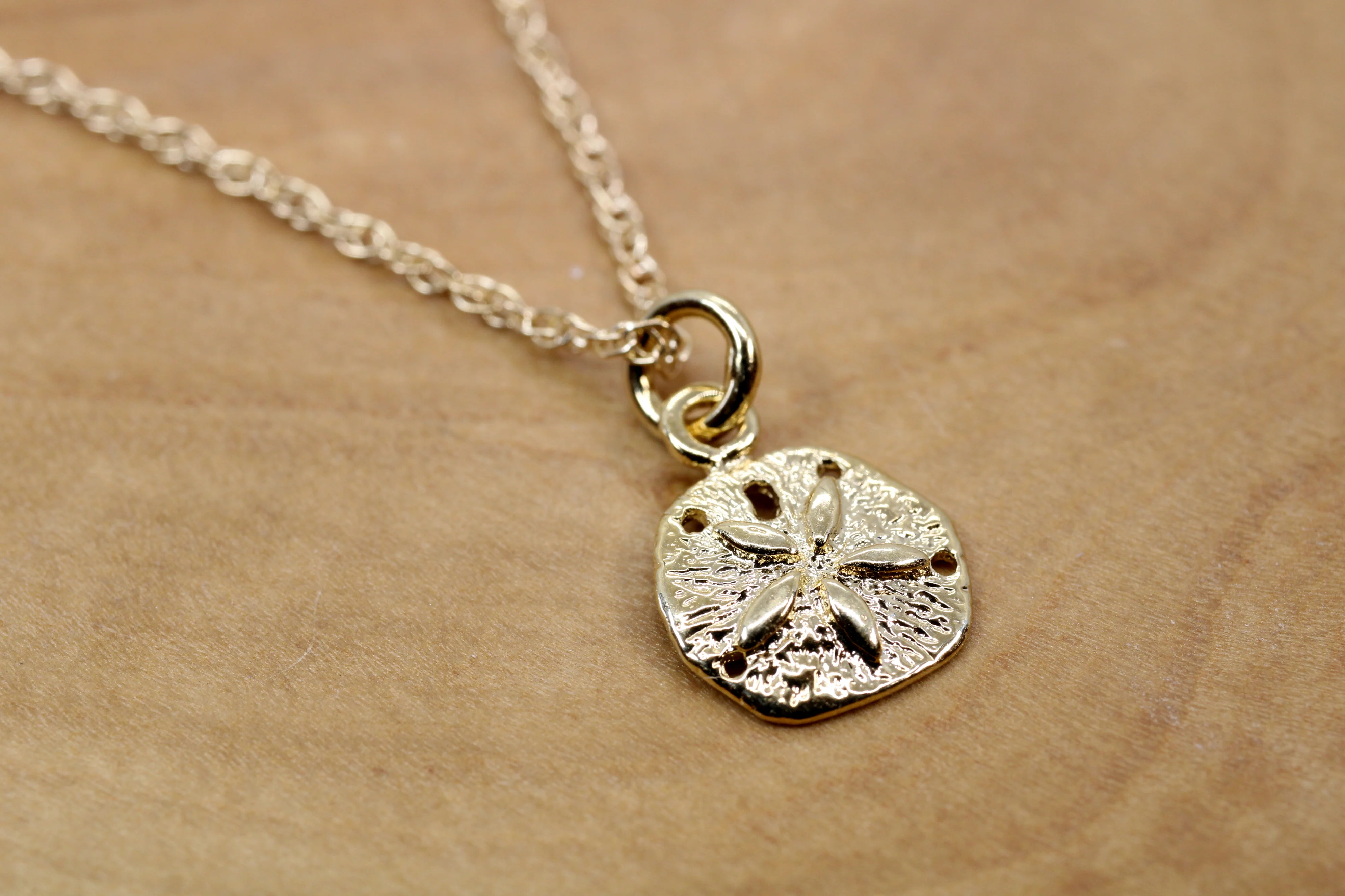 What is the height of the sand dollar?