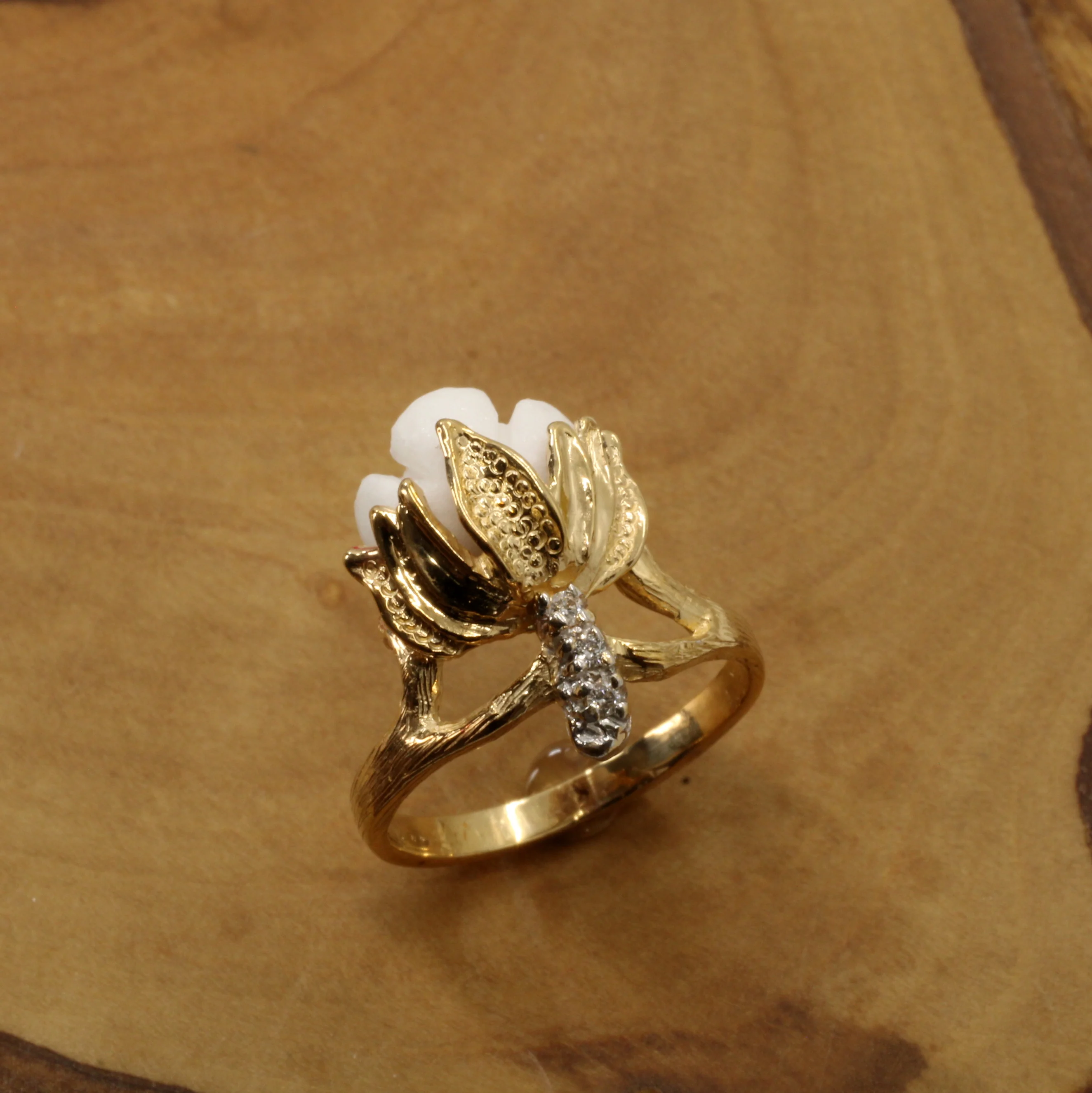 Ladies Cotton Boll Ring with Hand Carved white stone and diamonds Questions & Answers