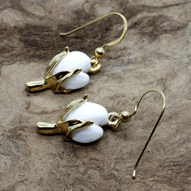A pair of cotton boll earrings.