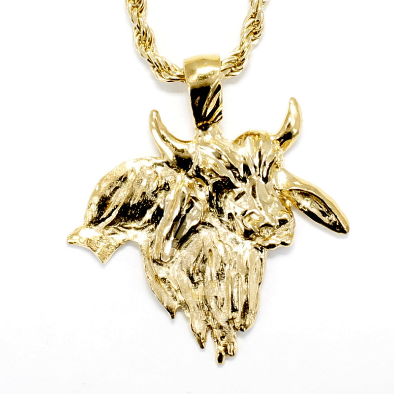 A gold bull necklace.
